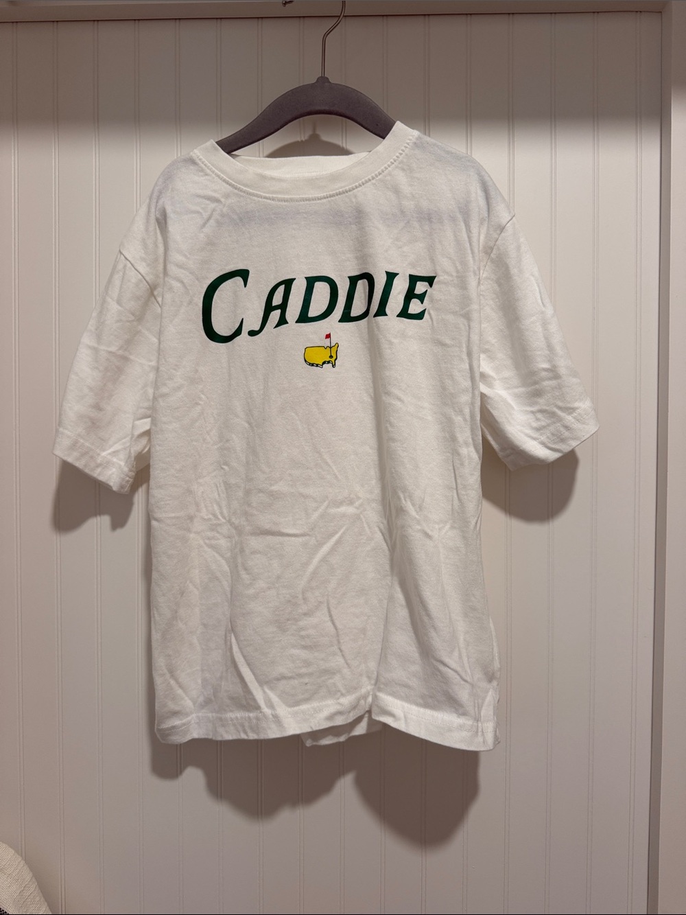 Masters White Tee with Green "Caddie" Script and Yellow Logo